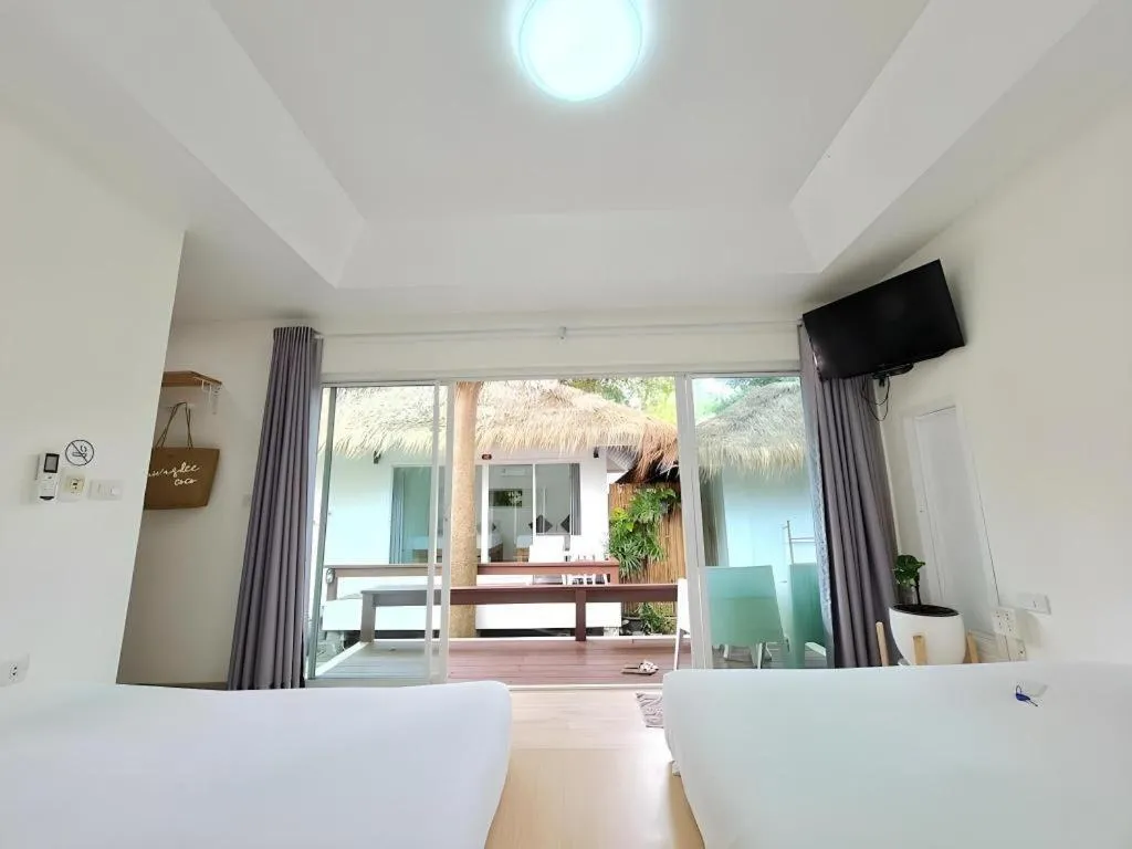 Bed in Sawasdee Coco Resort