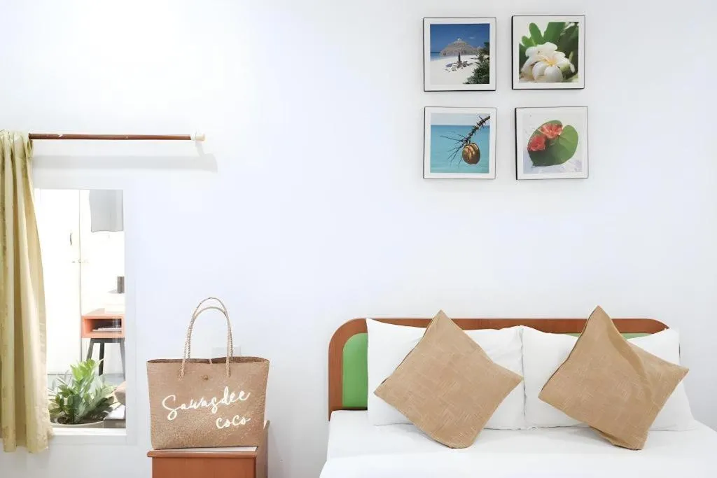 Bed in Sawasdee Coco Resort