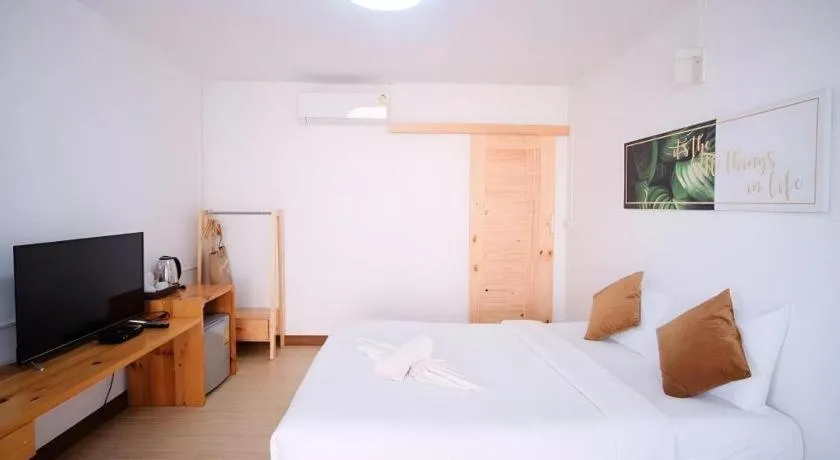 Bed in Sawasdee Coco Resort