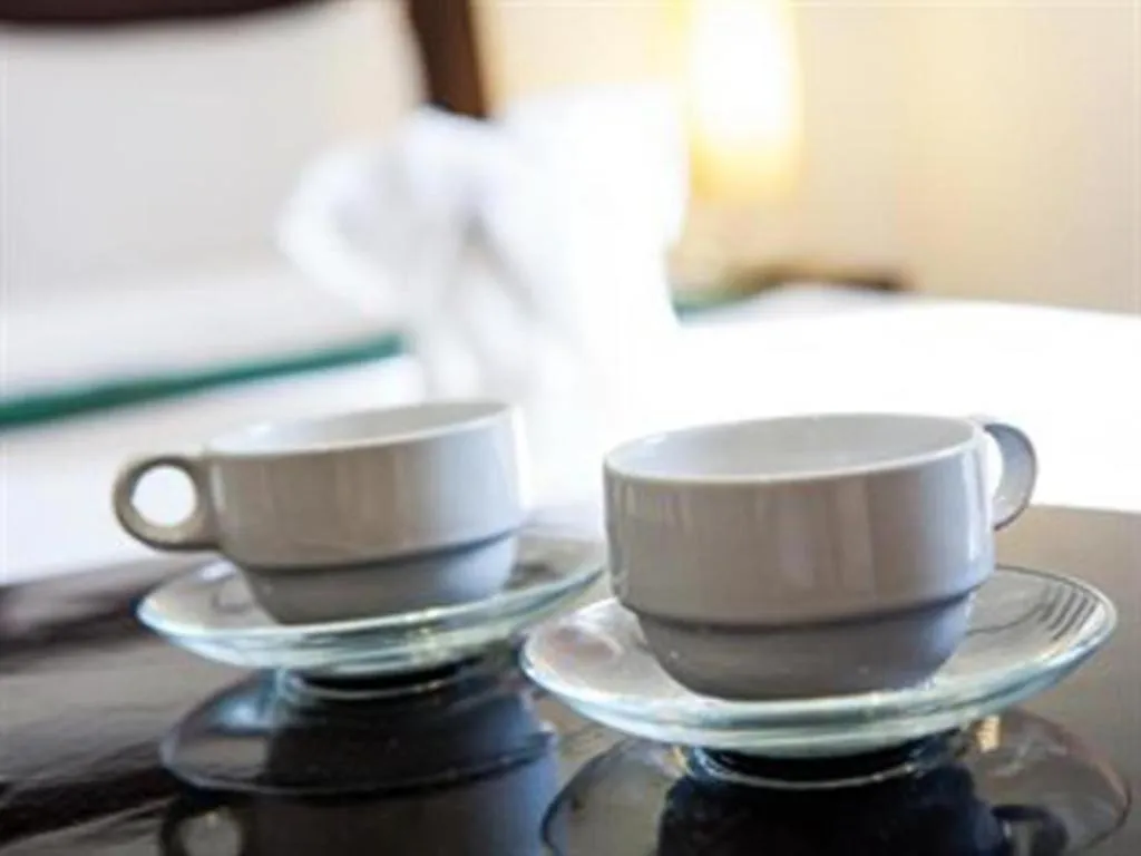 Bed in Triple Rund Place Hotel