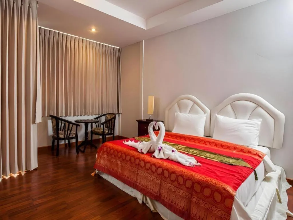 Bed in Triple Rund Place Hotel