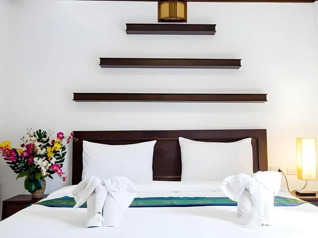 Bed in Triple Rund Place Hotel