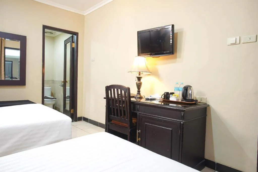 Bed in Sriwijaya Hotel
