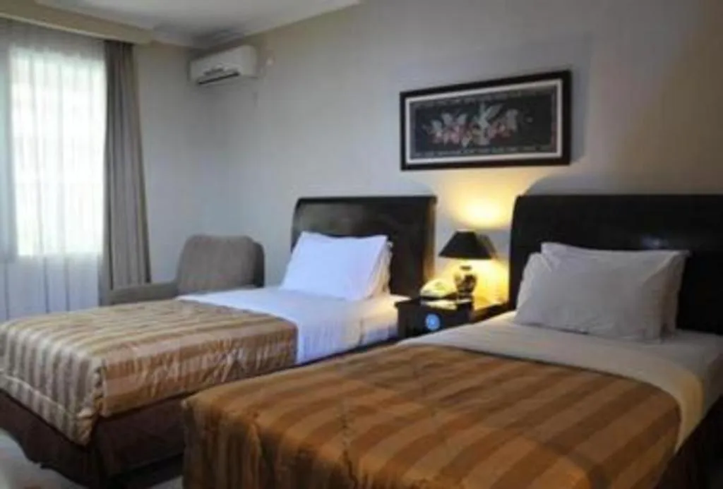 Bed in Sriwijaya Hotel