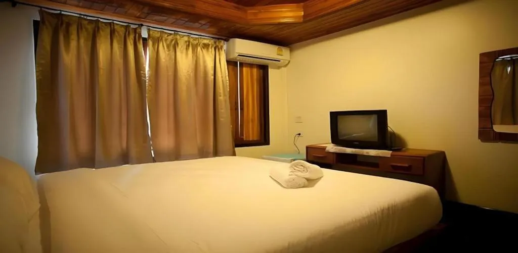 Bed in Srisawat Resort