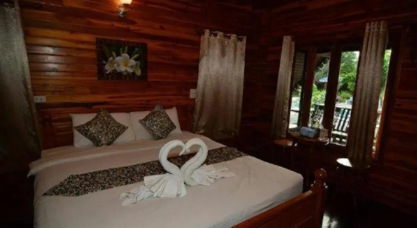 Bed in Srisawat Resort