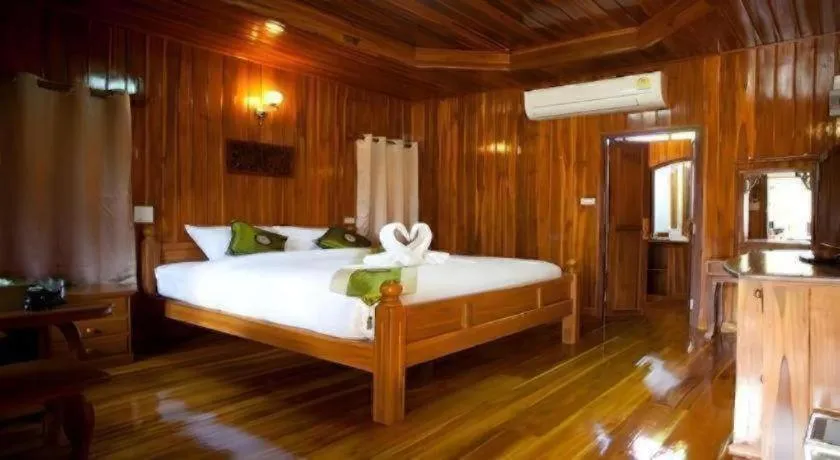 Bed in Srisawat Resort