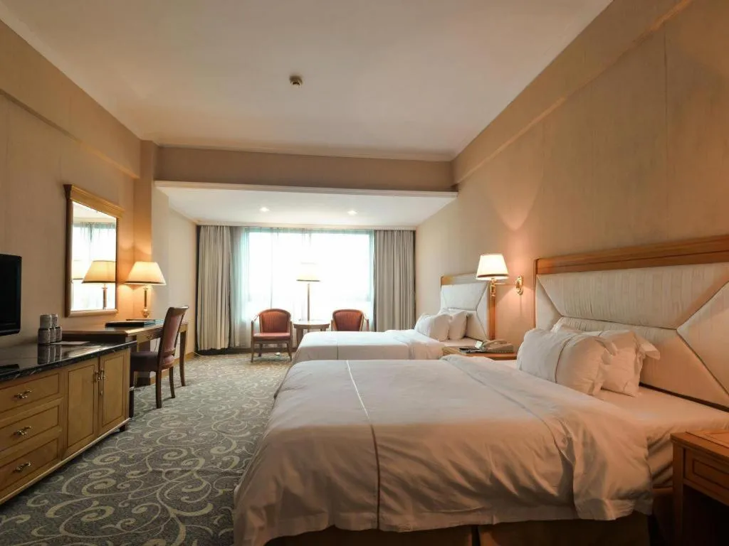 Bed in New Pearl River Hotel