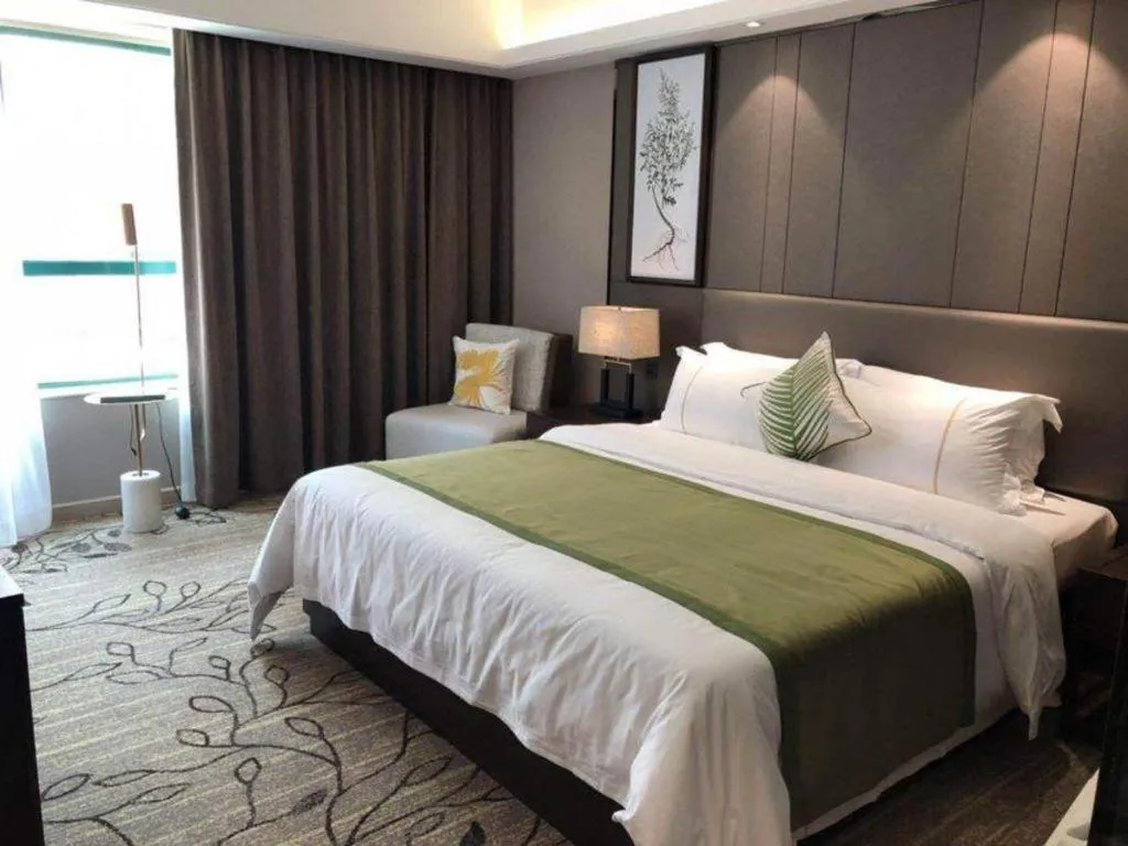 Bed in New Pearl River Hotel