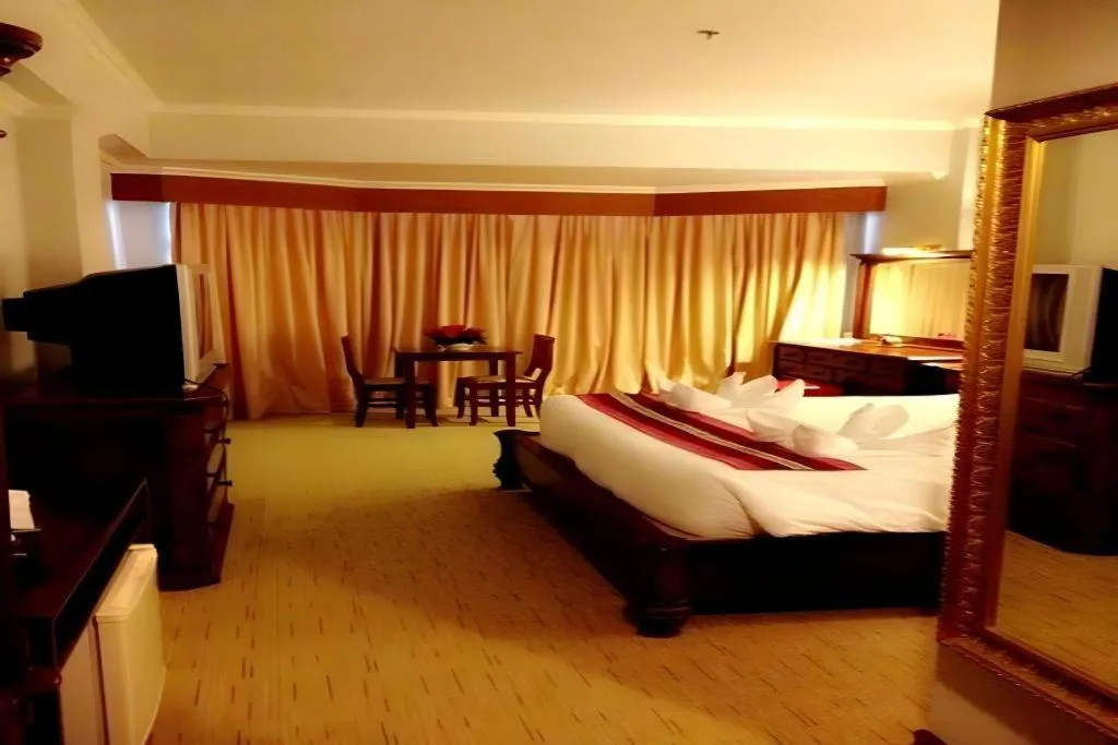 Bed in Thepnakorn Hotel
