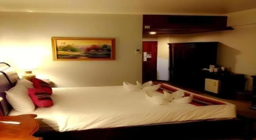 Bed in Thepnakorn Hotel