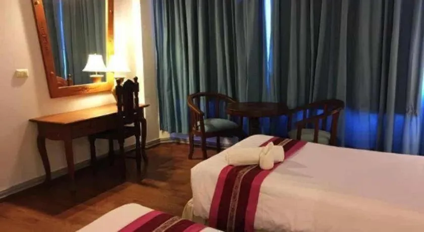 Bed in Thepnakorn Hotel