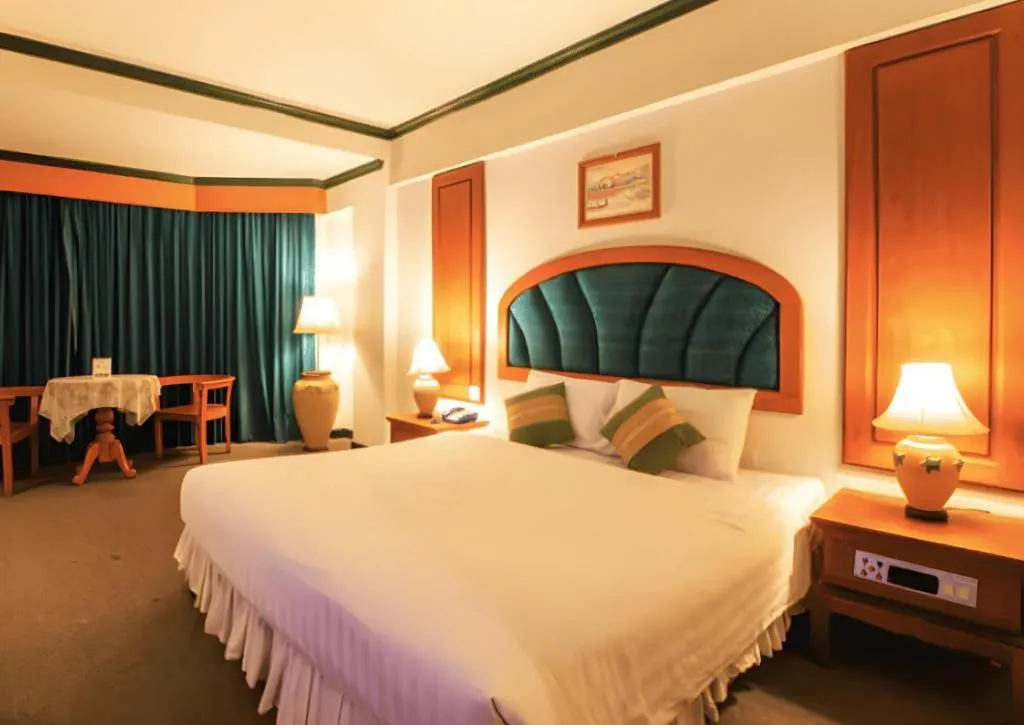 Bed in Thepnakorn Hotel