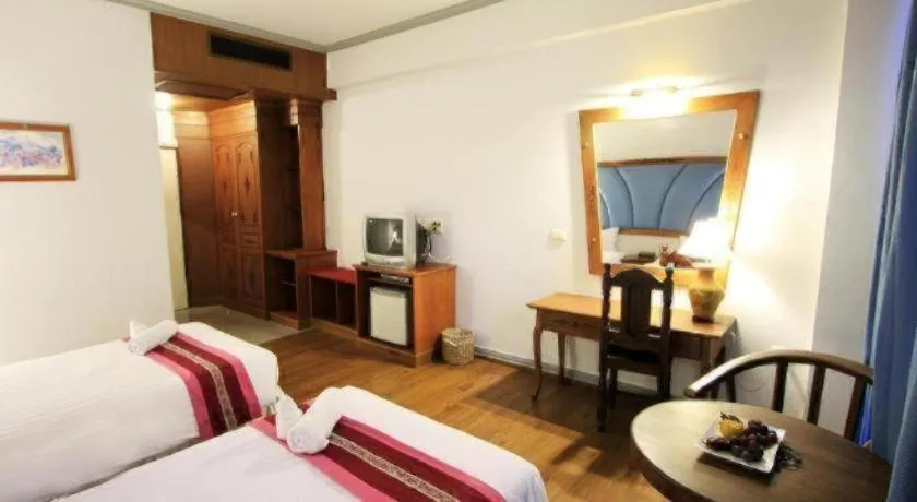 Bed in Thepnakorn Hotel