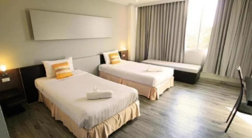 Bed in Thepnakorn Hotel