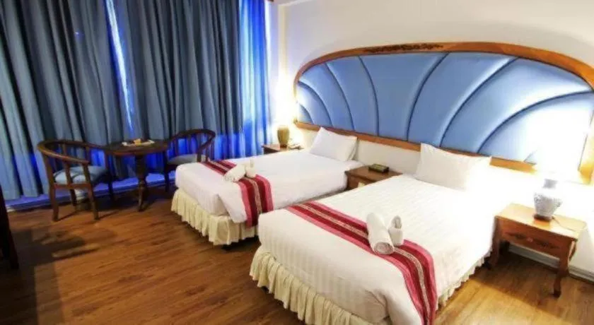 Bed in Thepnakorn Hotel