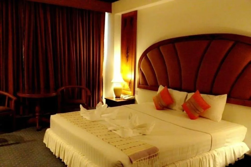 Bed in Thepnakorn Hotel