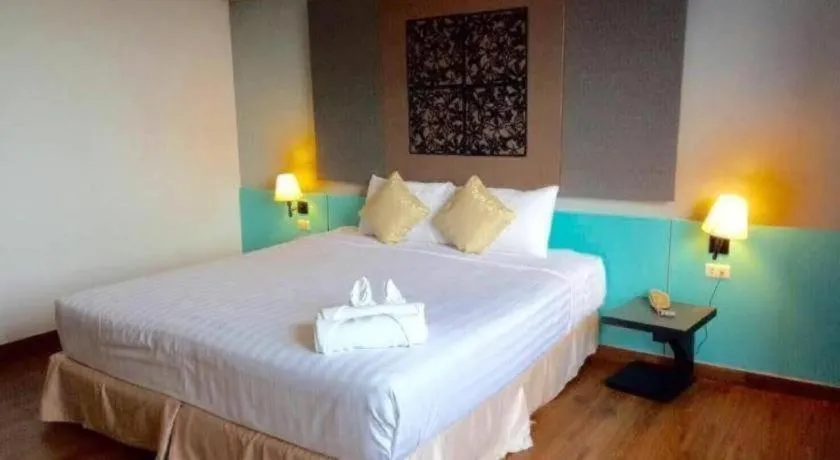 Bed in Thepnakorn Hotel