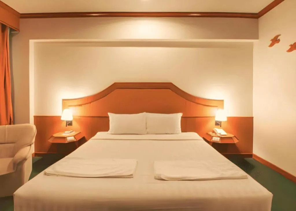Bed in Thepnakorn Hotel