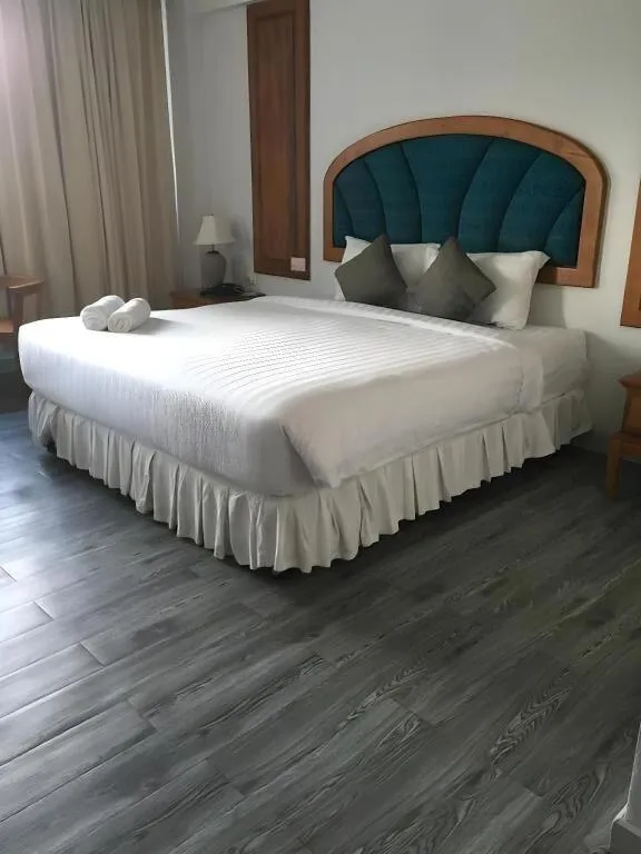 Bed in Thepnakorn Hotel