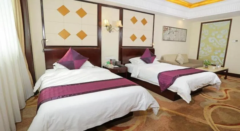 Bed in Sun City Hotel Haikou