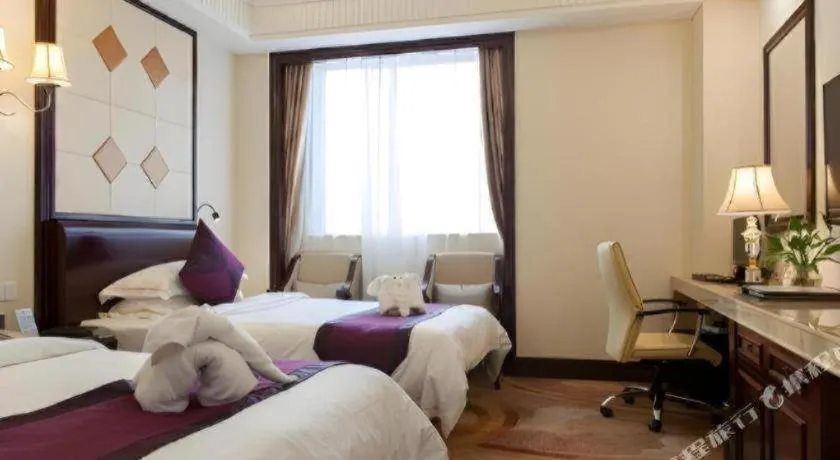 Bed in Sun City Hotel Haikou