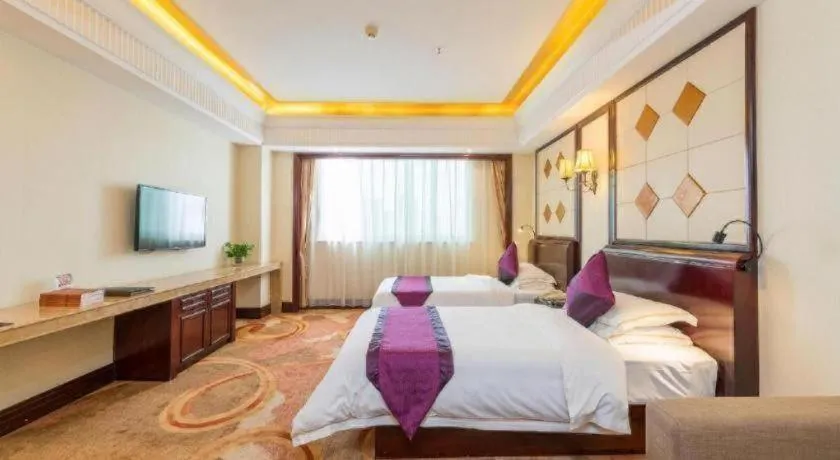 Bed in Sun City Hotel Haikou