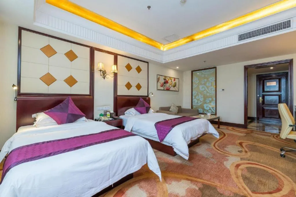 Bed in Sun City Hotel Haikou