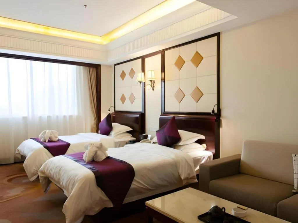Bed in Sun City Hotel Haikou