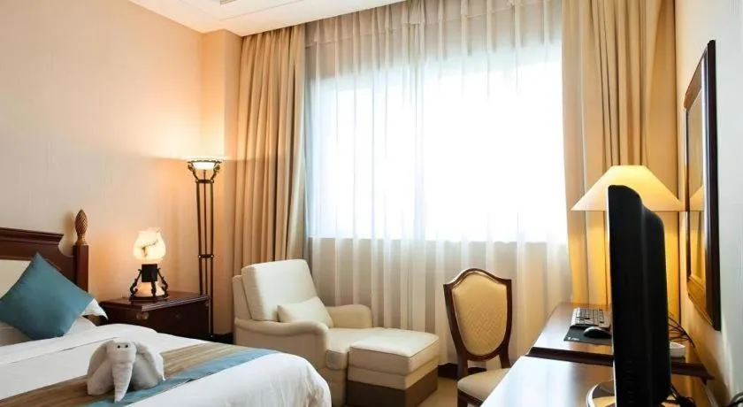 Bed in Sun City Hotel Haikou