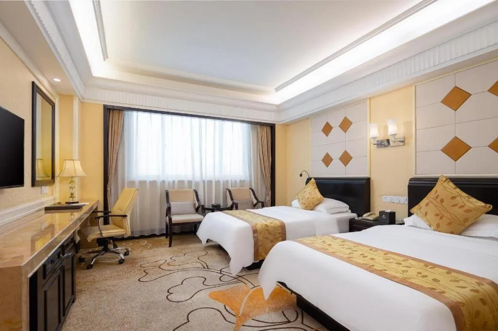 Bed in Sun City Hotel Haikou