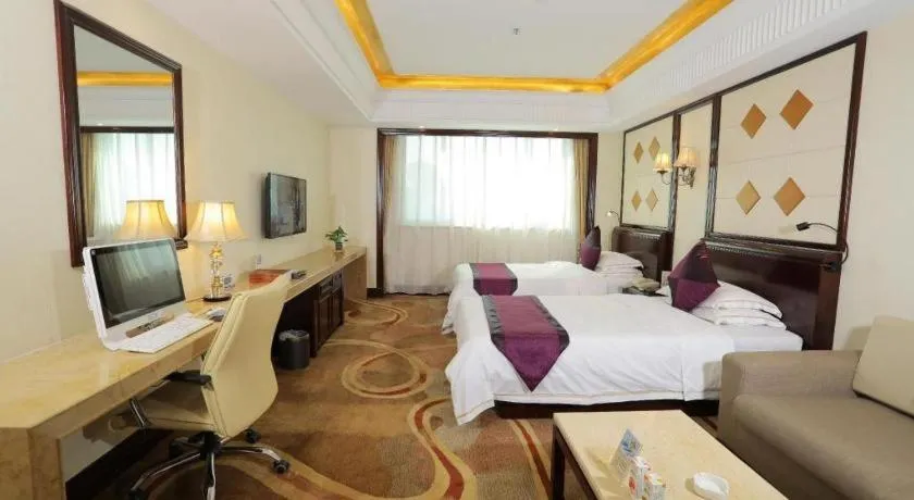 Bed in Sun City Hotel Haikou