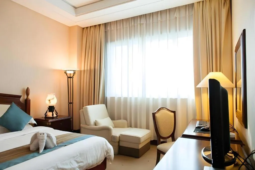 Bed in Sun City Hotel Haikou