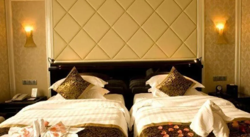 Bed in Sun City Hotel Haikou