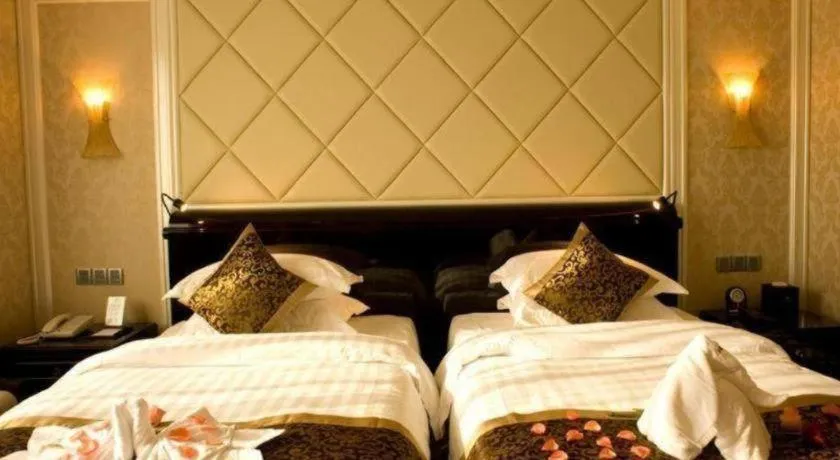 Bed in Sun City Hotel Haikou