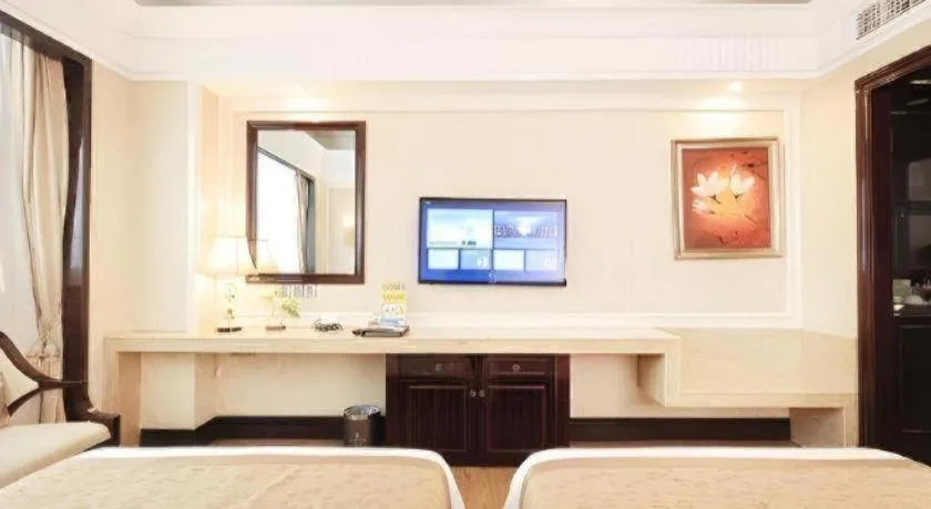 Bed in Sun City Hotel Haikou