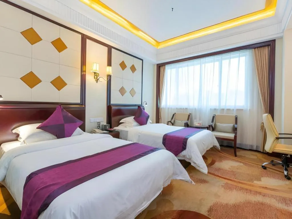 Bed in Sun City Hotel Haikou