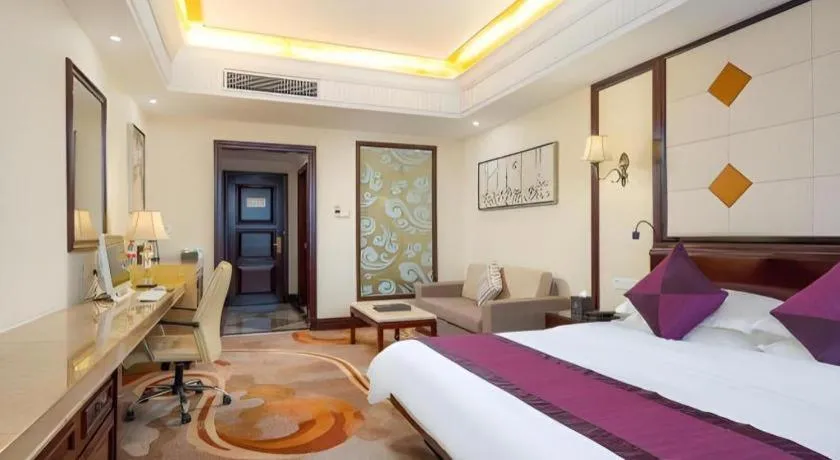 Bed in Sun City Hotel Haikou