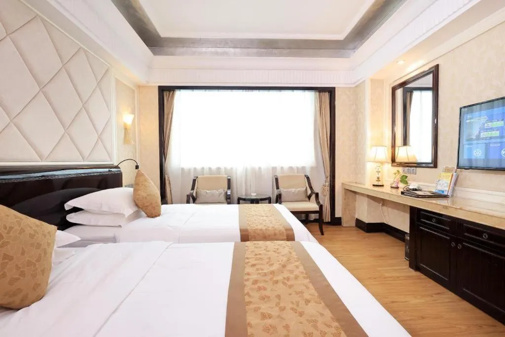 Bed in Sun City Hotel Haikou