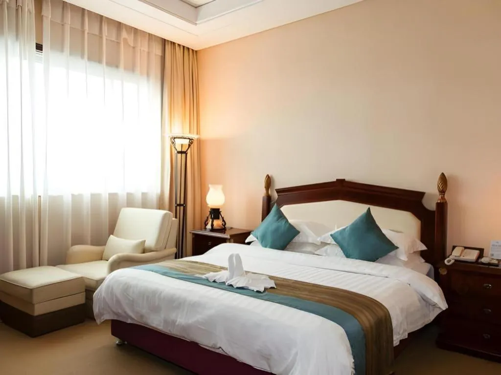 Bed in Sun City Hotel Haikou