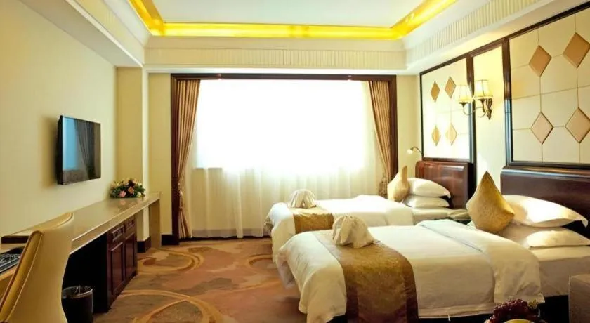 Bed in Sun City Hotel Haikou