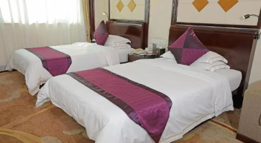 Bed in Sun City Hotel Haikou