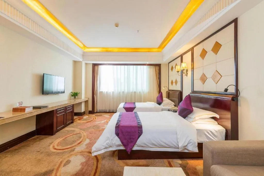 Bed in Sun City Hotel Haikou