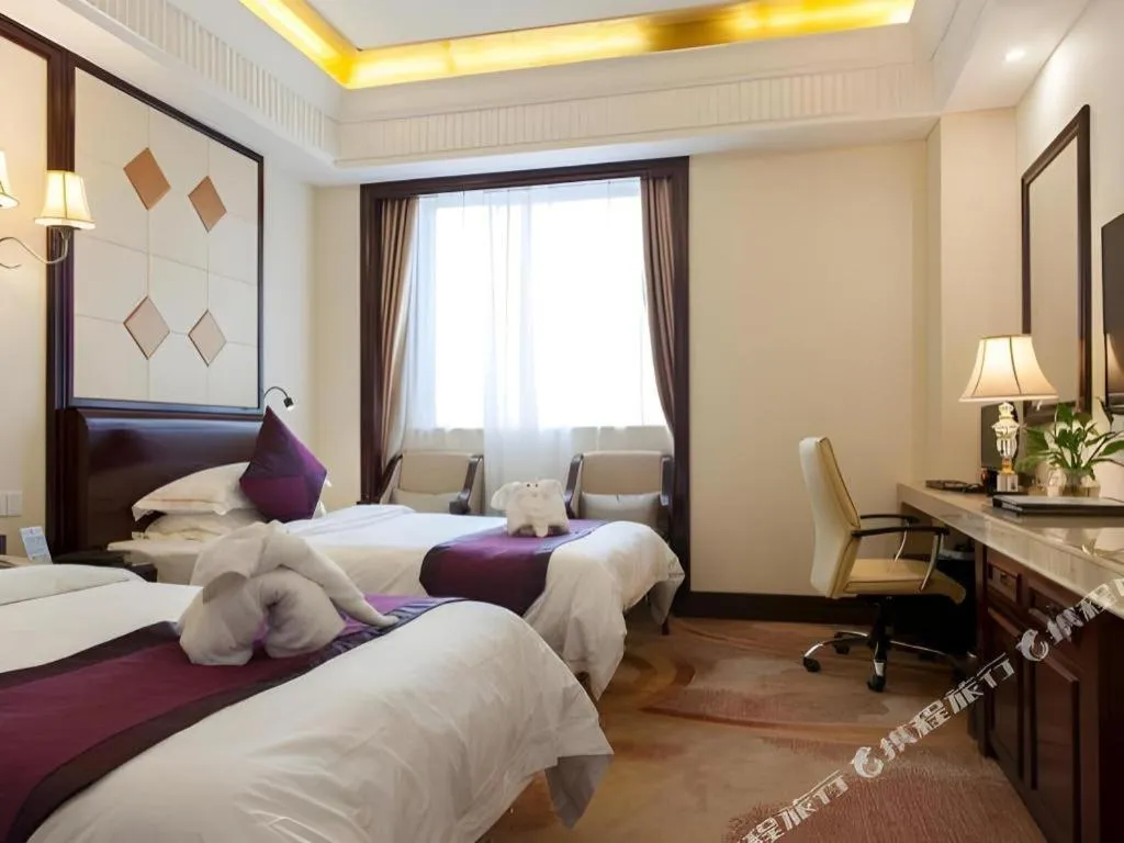Bed in Sun City Hotel Haikou