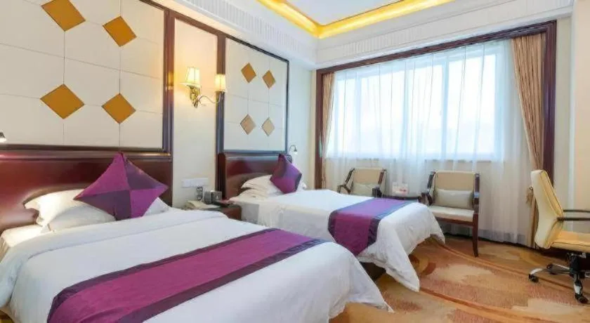 Bed in Sun City Hotel Haikou