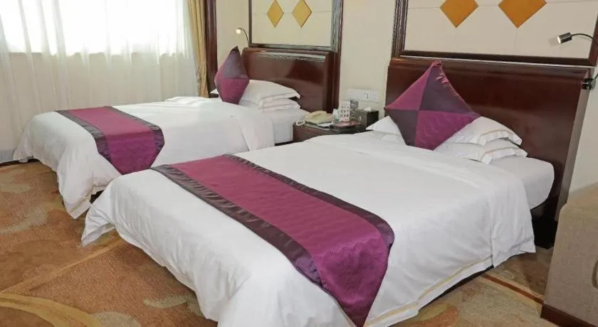 Bed in Sun City Hotel Haikou