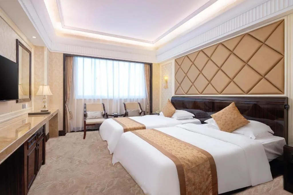 Bed in Sun City Hotel Haikou