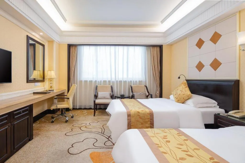 Bed in Sun City Hotel Haikou