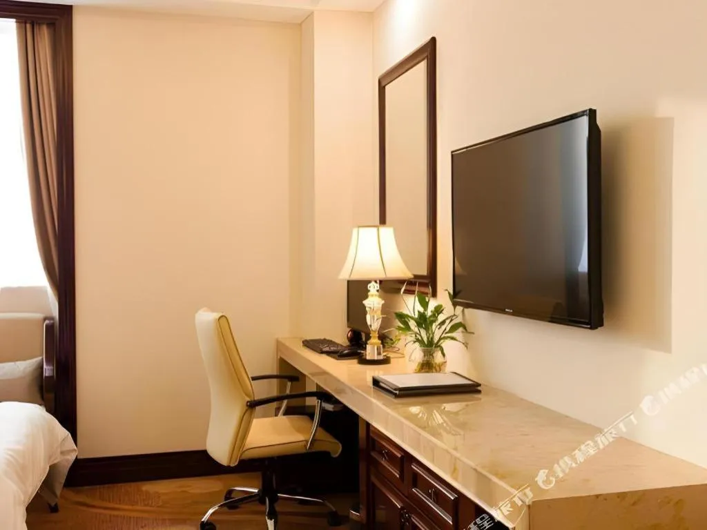 Bed in Sun City Hotel Haikou