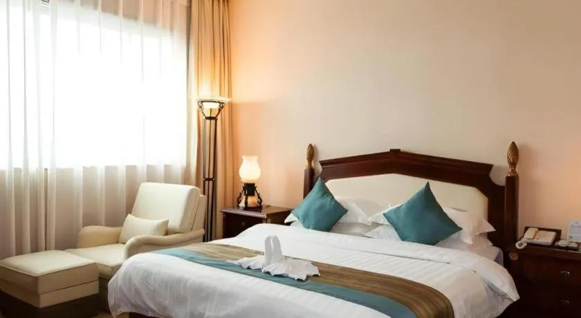 Bed in Sun City Hotel Haikou